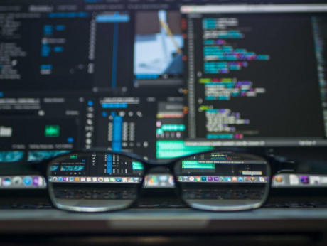 Glasses next to computer screen