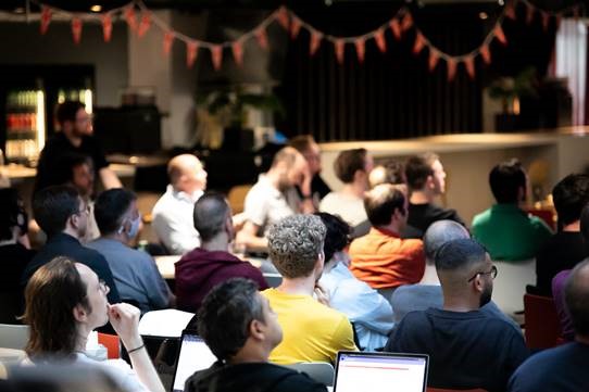 Photograph of participants being briefed at the G-Research Engineering Hackathon